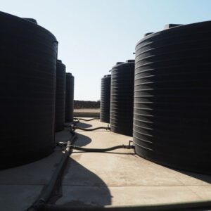 Line of Nu-Tank Round Molasses Storage Tanks.